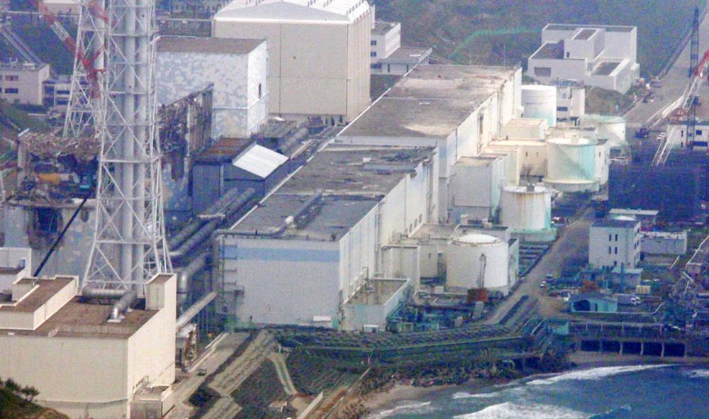  In this May 28, 2012 aerial file photo, reactors of the tsunami-stricken Fukushima Dai-ichi nuclear power plant stand in Okuma, Fukushima Prefecture, northeastern Japan. An underwater robot on Wednesday, July 19, 2017, captured images and other data inside Japan's crippled Fukushima nuclear plant on its first day of work. The robot is on a mission to study damage and find fuel that experts say has melted and mostly fallen to the bottom of a chamber and has been submerged by highly radioactive water. (AP Photo/Tom Curley, File)